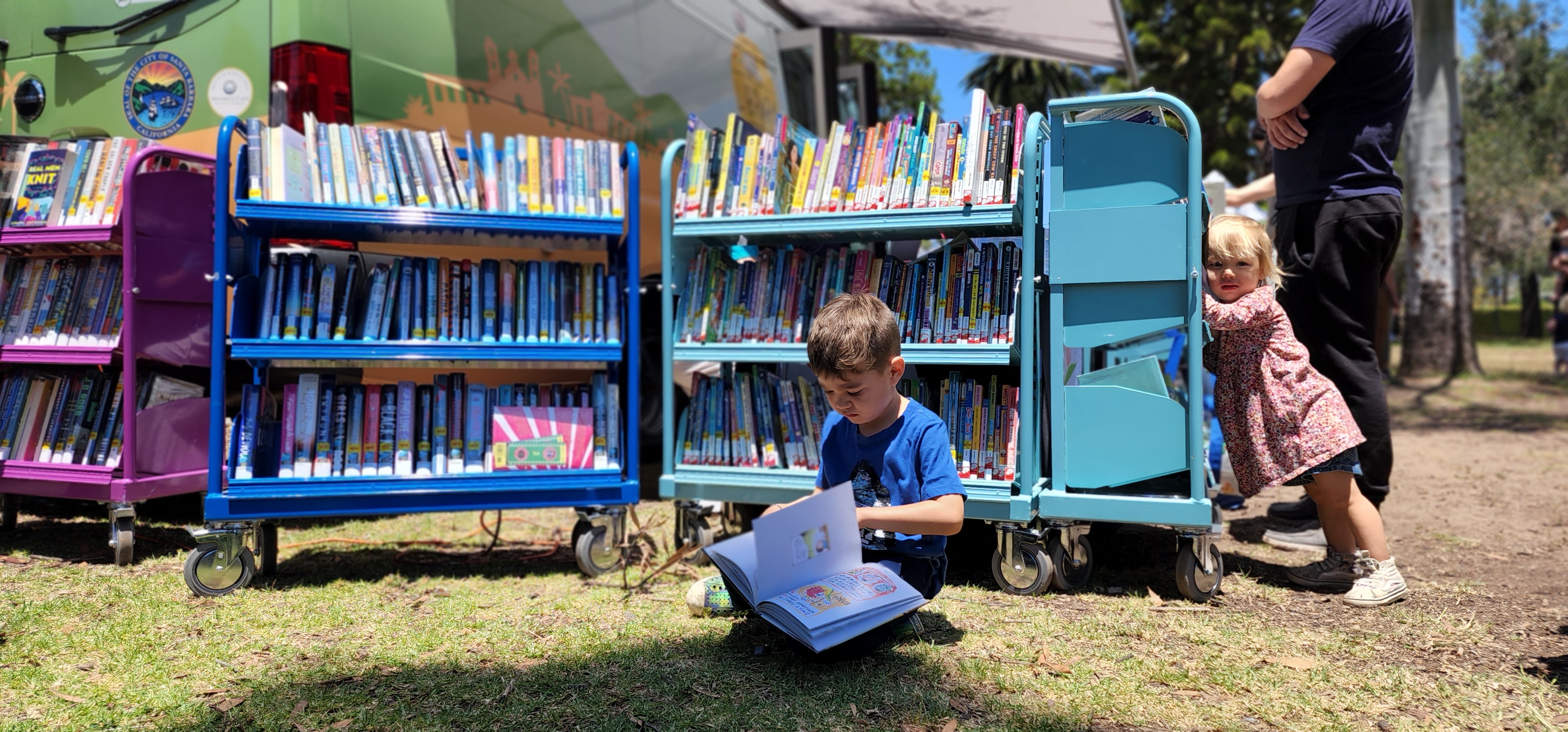 Child reading on grass