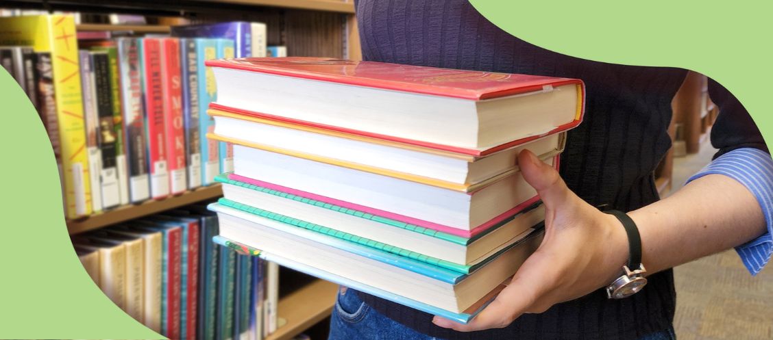 Staff holding books