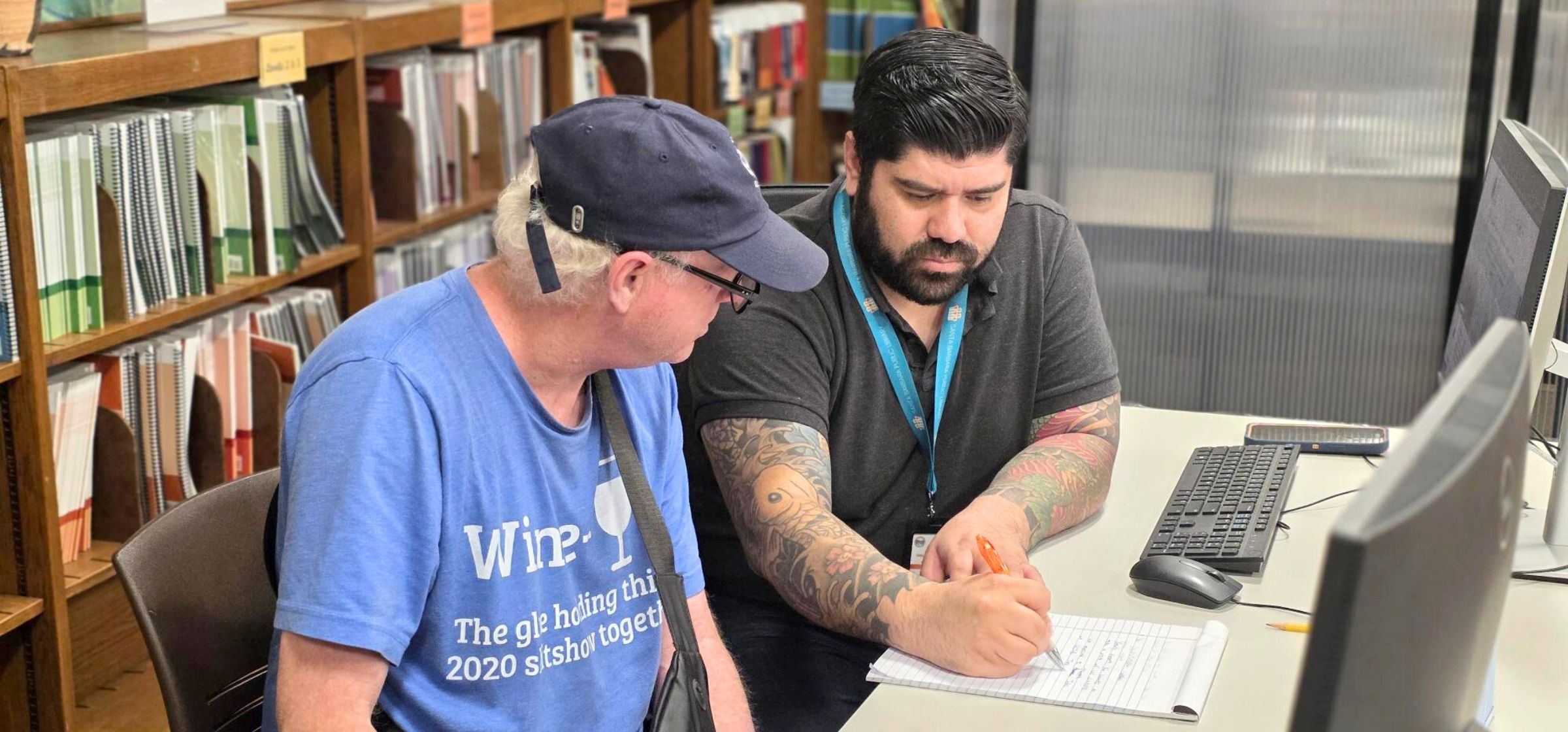 Works! team member assists patron in creating resume