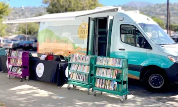 van and book trucks outside