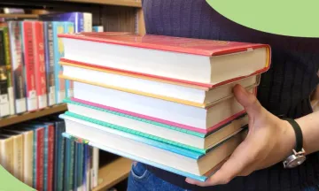 Staff holding books