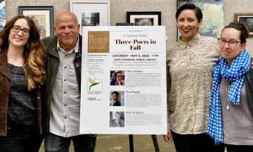 Poet Laureate Emma Trelles standing with other poets in the Faulkner Gallery