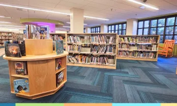lower level childrens library with gondolas of books