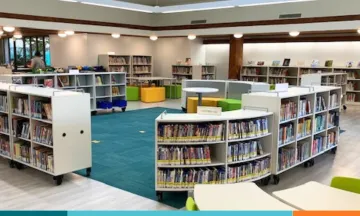 Library interior filled bookshelves