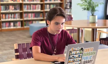 Teen using laptop