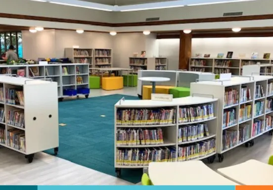 Library interior filled bookshelves