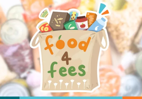 Grocery bag filled with food with the text "Food 4 Fees" on its side