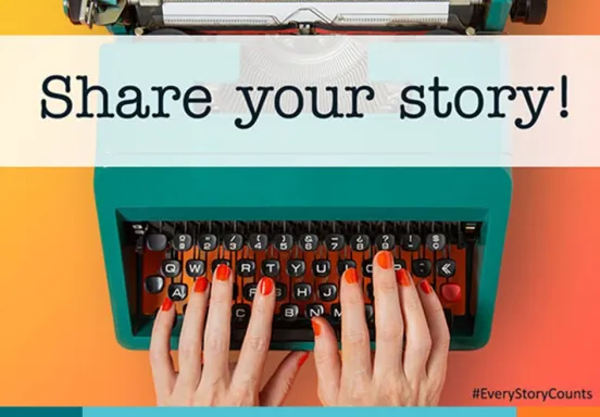 Hands typing on a typewriter