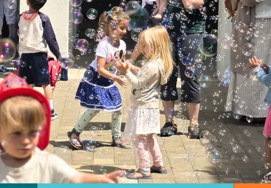 children play in bubbles at santa barbara public library