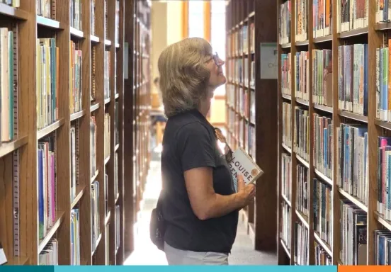 Library patron browses the stacks