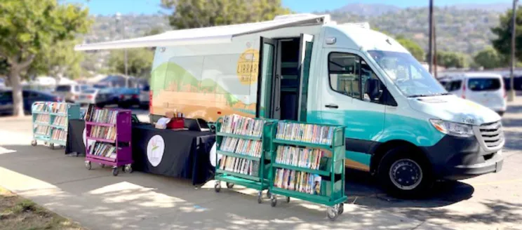 van and book trucks outside