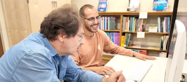 tutor and learner at computer