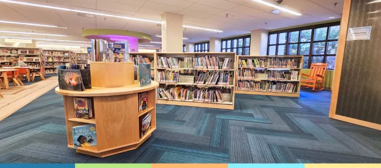 lower level childrens library with gondolas of books