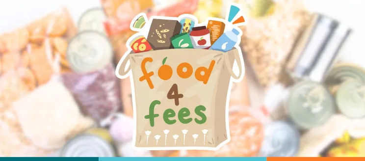 Grocery bag filled with food with the text "Food 4 Fees" on its side