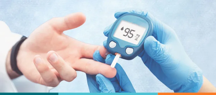 outstretched hand and finger-test diabetes reader performing diabetes test