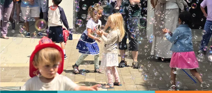children play in bubbles at santa barbara public library