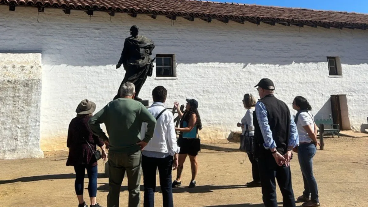 Tour group looking at a statue