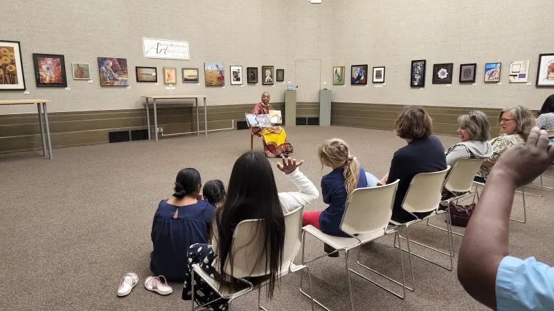 Sojourner Kincaide Rolle reading to children